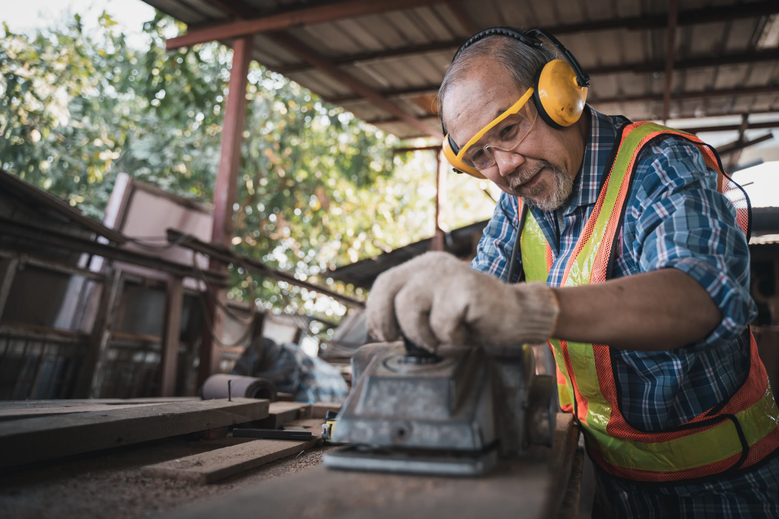 Senior carpenter working on wood