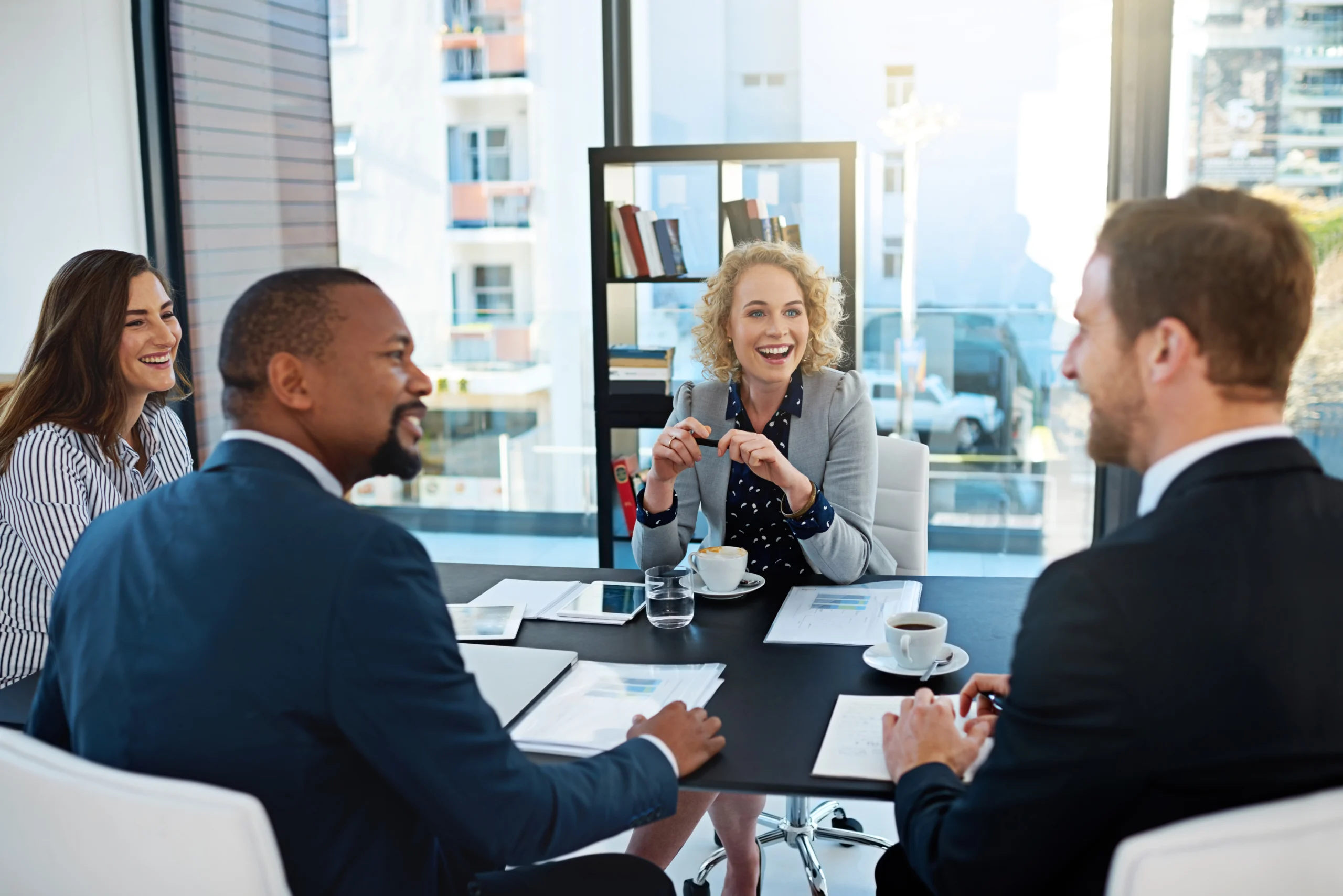 Small law firm team in meeting RJHP Why Small Business Group Health