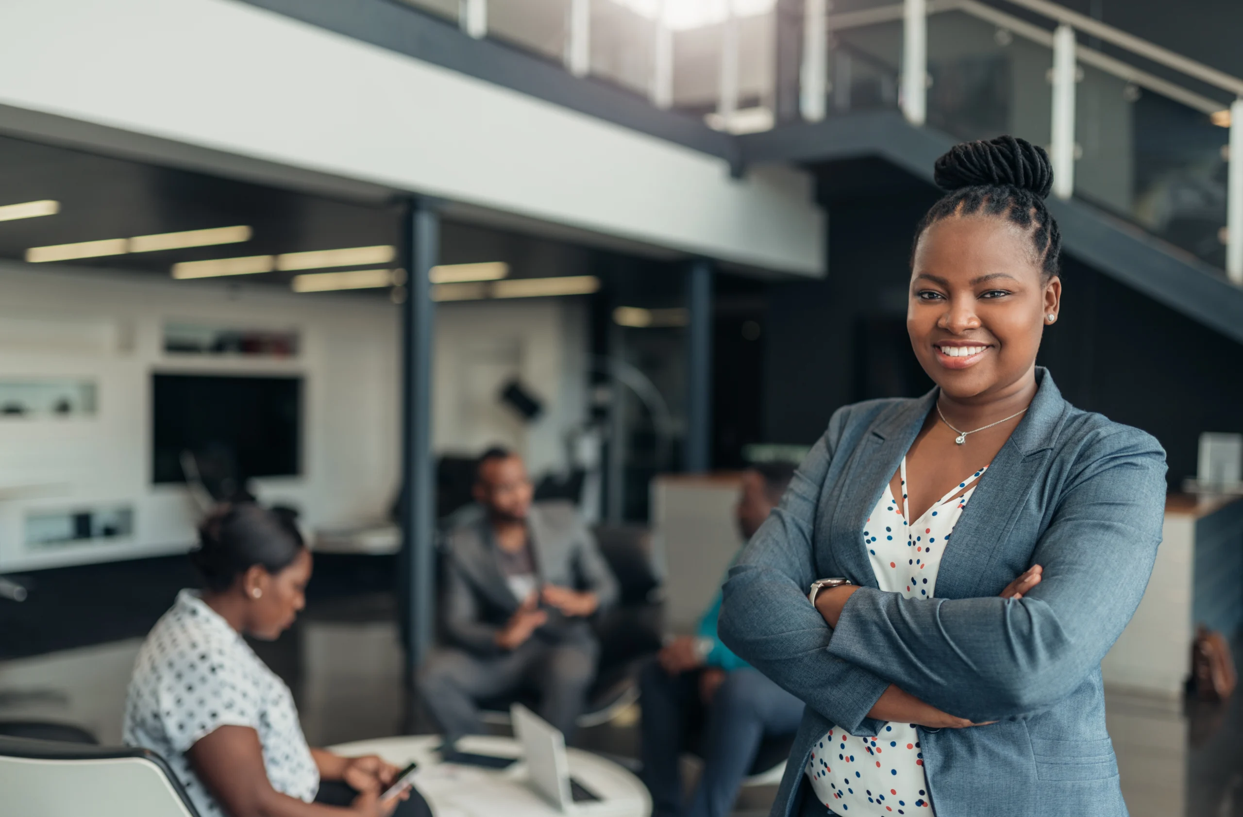 -confident-black-businesswoman-standing-with-arms-crossed-in-a-modern-office-building- Are You an Applicable Large Employer?